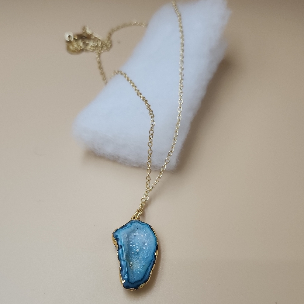 Elegant Gold Necklace with Blue Pendant